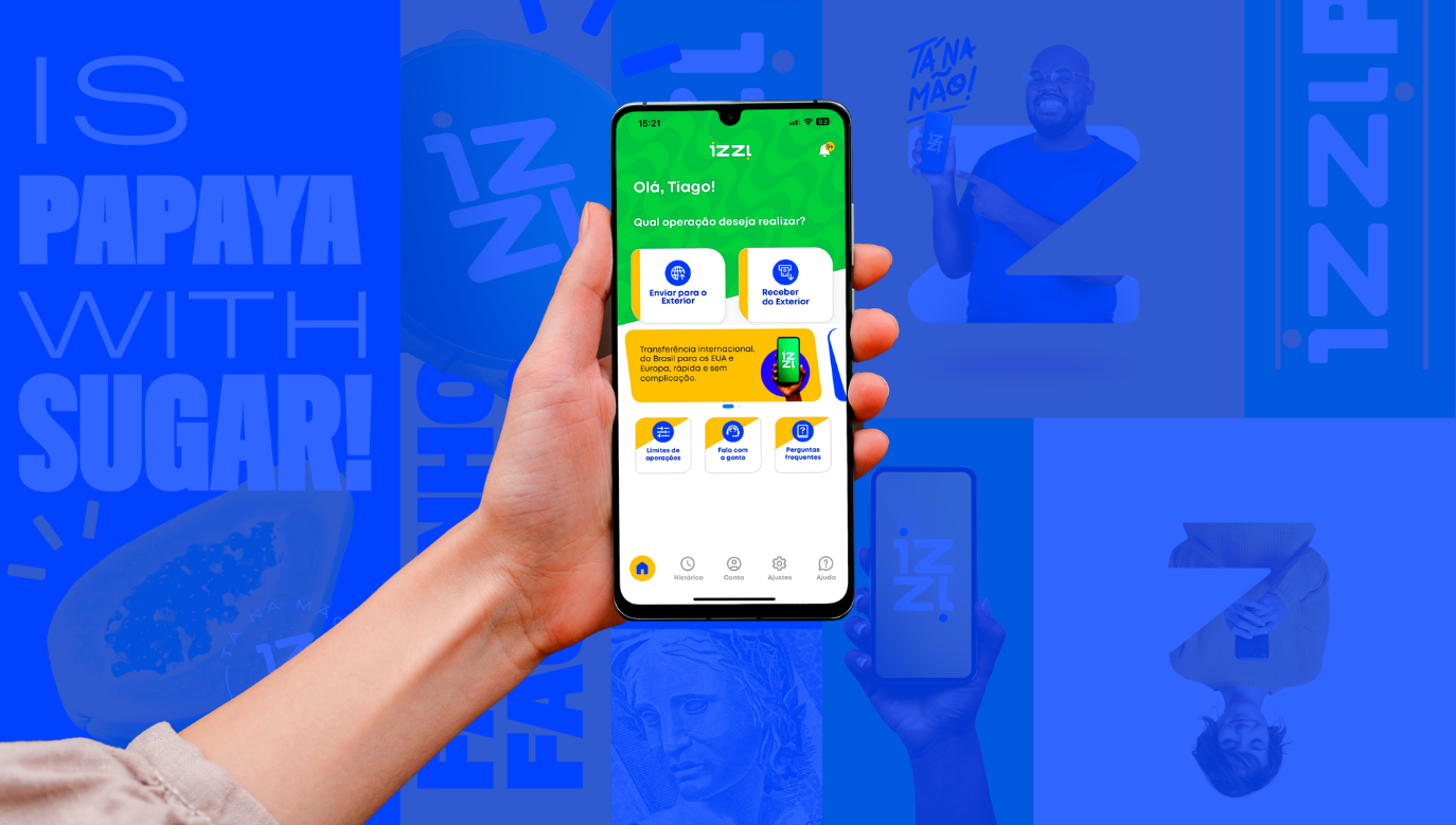 Mão segurando o celular com a tela mostrando o IZZI, o melhor app para receber do exterior.